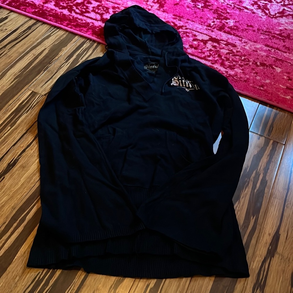 Long sleeve sweater with rhinestone back